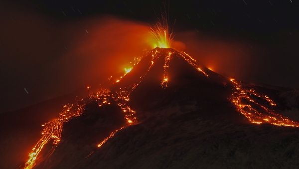 An eruption from Mount Etna lights up the sky during the night, seen from the small village of Fornazzo, under the volcano, Italy, January 19, 2021 - Sputnik International