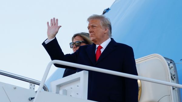 U.S. President Donald Trump, accompanied by first lady Melania Trump, waves as he boards Air Force One at Joint Base Andrews, Maryland, U.S., January 20, 2021. REUTERS/Carlos Barria U.S. President Donald Trump, accompanied by first lady Melania Trump, waves as he boards Air Force One at Joint Base Andrews, Maryland, U.S., January 20, 2021. REUTERS/Carlos Barria - Sputnik International