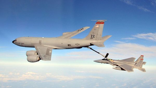 F-15C Eagles from the 67th Fighter Squadron at Kadena Air Base, Japan, are refueled by a KC-135R Stratotanker from the 909th Air Refueling Squadron during joint bilateral training with other U.S. forces and the Japan Air Self Defense Force Feb. 25, 2010. - Sputnik International
