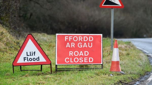 A warning sign is seen after Storm Christoph hit Wales causing floods, in Tenby, Britain, January 21, 2021 - Sputnik International