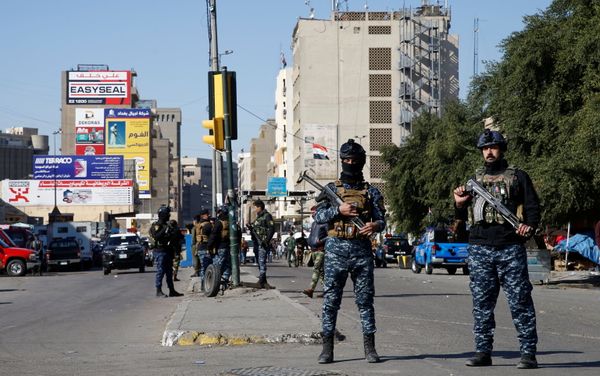 Members of Iraqi security forces keep guard at the site of a twin suicide bombing attack in a central market in Baghdad, Iraq January 21, 2021 - Sputnik International