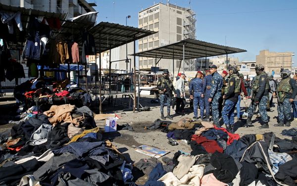 Members of Iraqi security forces gather at the site of a twin suicide bombing attack in a central market in Baghdad, Iraq January 21, 2021.  - Sputnik International