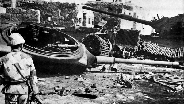 An Egyptian Sa'iqa (commando) before a group of knocked out Israeli tanks, in the village of Abu 'Atwa, during the Battle of Ismailia, Yom Kippur War. An Egyptian Sa'iqa (commando) before a group of knocked out Israeli tanks, in the village of Abu 'Atwa, during the Battle of Ismailia, Yom Kippur War. - Sputnik International