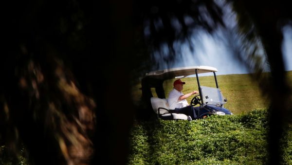 U.S. President Donald Trump plays golf at the Trump International Golf Club in West Palm Beach, Florida, U.S., December 28, 2020. - Sputnik International