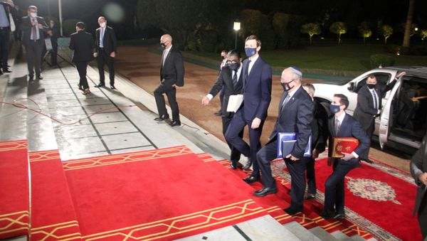 Israeli National Security Adviser Meir Ben-Shabbat (front R), who led the Israeli delegation, and U.S. White House Senior Adviser Jared Kushner are seen during a visit to Rabat, Morocco, December 22, 2020. - Sputnik International