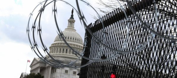 Barbed wire is seen on a fence as U.S. President-elect Joe Biden arrives at the U.S. Capitol for his inauguration as the 46th President of the United States, in Washington, U.S., January 20, 2021. - Sputnik International