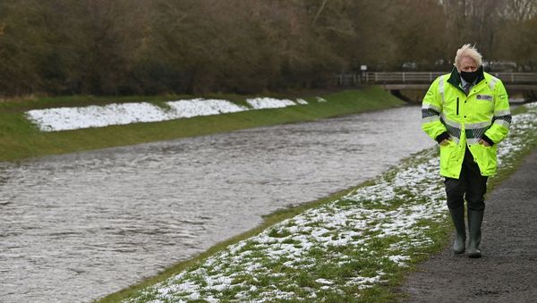 Britain's Prime Minister Boris Johnson reacts during his visit to a storm basin near the River Mersey in  Didsbury, Manchester, as Storm Christoph brings heavy rains and flooding across the country, Britain January 21, 2021 - Sputnik International