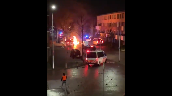 Screenshot of a video showing flames on a city street in the Netherlands during anti-lockdownprotests Screenshot of a video showing flames on a city street in the Netherlands during anti-lockdownprotests - Sputnik International