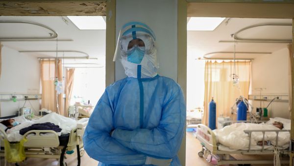 FILE PHOTO: A medical worker in protective suit takes a break at an isolated ward of Wuhan Red Cross Hospital in Wuhan, the epicentre of the novel coronavirus outbreak, in Hubei province, China February 16, 2020 FILE PHOTO: A medical worker in protective suit takes a break at an isolated ward of Wuhan Red Cross Hospital in Wuhan, the epicentre of the novel coronavirus outbreak, in Hubei province, China February 16, 2020 - Sputnik International