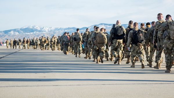 Idaho National Guard soldiers and airmen form a line to depart for Washington, D.C. to provide additional security with the inauguration of U.S. President-elect Joe Biden, in Boise, Idaho, U.S. January 15, 2021. Picture taken January 15, 2021.  U.S. National Guard/Master Sgt. Becky Vanshur/Handout via REUTERS - Sputnik International