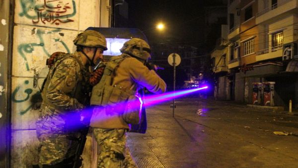 Army soldiers clash with demonstrators during a protest against the lockdown and worsening economic conditions, amid the spread of the coronavirus disease (COVID-19), in Tripoli, Lebanon January 26, 2021 - Sputnik International