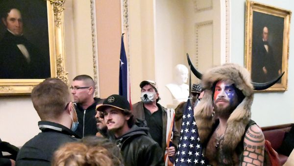 Jacob Anthony Chansley, also known as Jake Angeli, of Arizona, stands with other supporters of U.S. President Donald Trump as they demonstrate on the second floor of the U.S. Capitol near the entrance to the Senate after breaching security defenses, in Washington, U.S., January 6, 2021. Jacob Anthony Chansley, also known as Jake Angeli, of Arizona, stands with other supporters of U.S. President Donald Trump as they demonstrate on the second floor of the U.S. Capitol near the entrance to the Senate after breaching security defenses, in Washington, U.S., January 6, 2021. - Sputnik International
