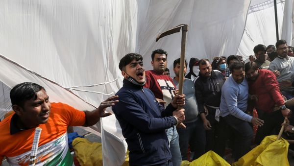 A man, from the group which raised the anti-farmers slogan, shouts as he holds a scythe, at a site of the protest against farm laws at Singhu border near New Delhi, India January 29, 2021. REUTERS/Anushree Fadnavis A man, from the group which raised the anti-farmers slogan, shouts as he holds a scythe, at a site of the protest against farm laws at Singhu border near New Delhi, India January 29, 2021. REUTERS/Anushree Fadnavis - Sputnik International