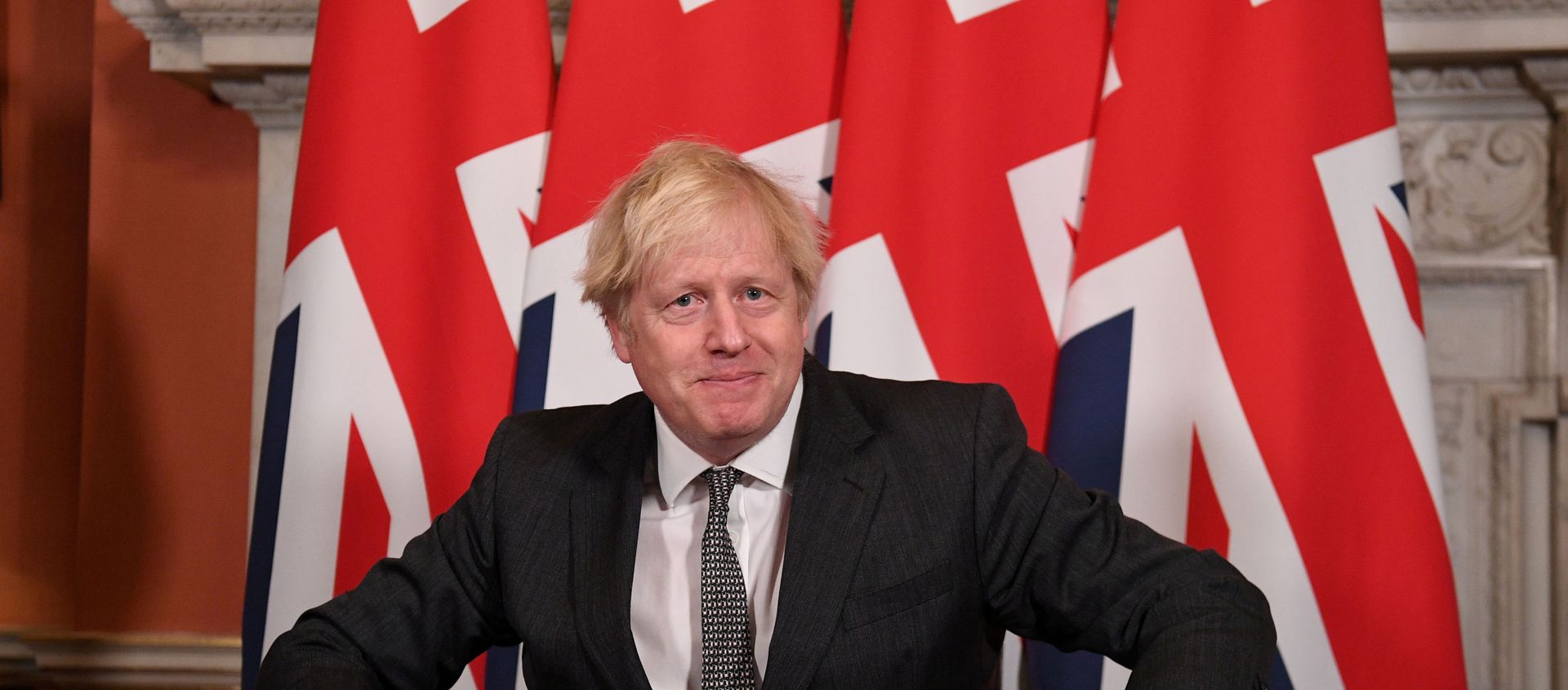 Britain's Prime Minister Boris Johnson reacts after signing the Brexit trade deal with the EU Britain's Prime Minister Boris Johnson reacts after signing the Brexit trade deal with the EU - Sputnik International, 1920, 12.02.2021