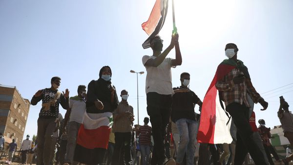 Protesters gather during a demonstration, in Khartoum, Sudan, Saturday, Dec. 19, 2020.  Protests in Sudan’s capital and across the country are demanding a faster pace to democratic reforms, in demonstrations that are marking the two-year anniversary of the uprising that led to the military’s ouster of strongman Omar al-Bashir. - Sputnik International