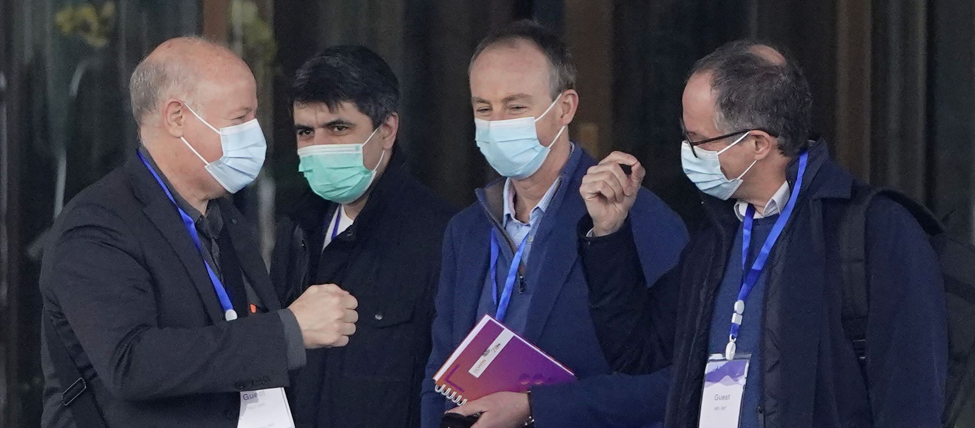 Peter Ben Embarek, right, gestures as Peter Daszak, left, approaches to bump fists with him before they leave the hotel with other members of a World Health Organization team for another day of field visit in Wuhan in central China's Hubei province Tuesday, Feb. 2, 2021 - Sputnik International, 1920, 22.03.2021