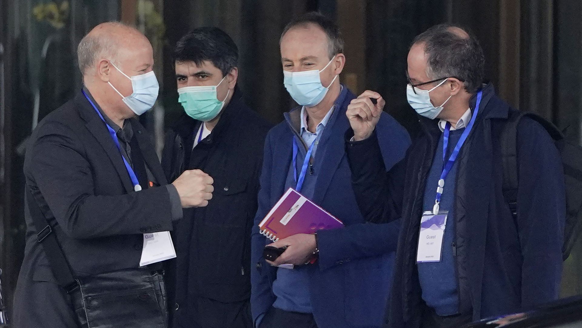 Peter Ben Embarek, right, gestures as Peter Daszak, left, approaches to bump fists with him before they leave the hotel with other members of a World Health Organization team for another day of field visit in Wuhan in central China's Hubei province Tuesday, Feb. 2, 2021 Peter Ben Embarek, right, gestures as Peter Daszak, left, approaches to bump fists with him before they leave the hotel with other members of a World Health Organization team for another day of field visit in Wuhan in central China's Hubei province Tuesday, Feb. 2, 2021 - Sputnik International, 1920, 22.03.2021