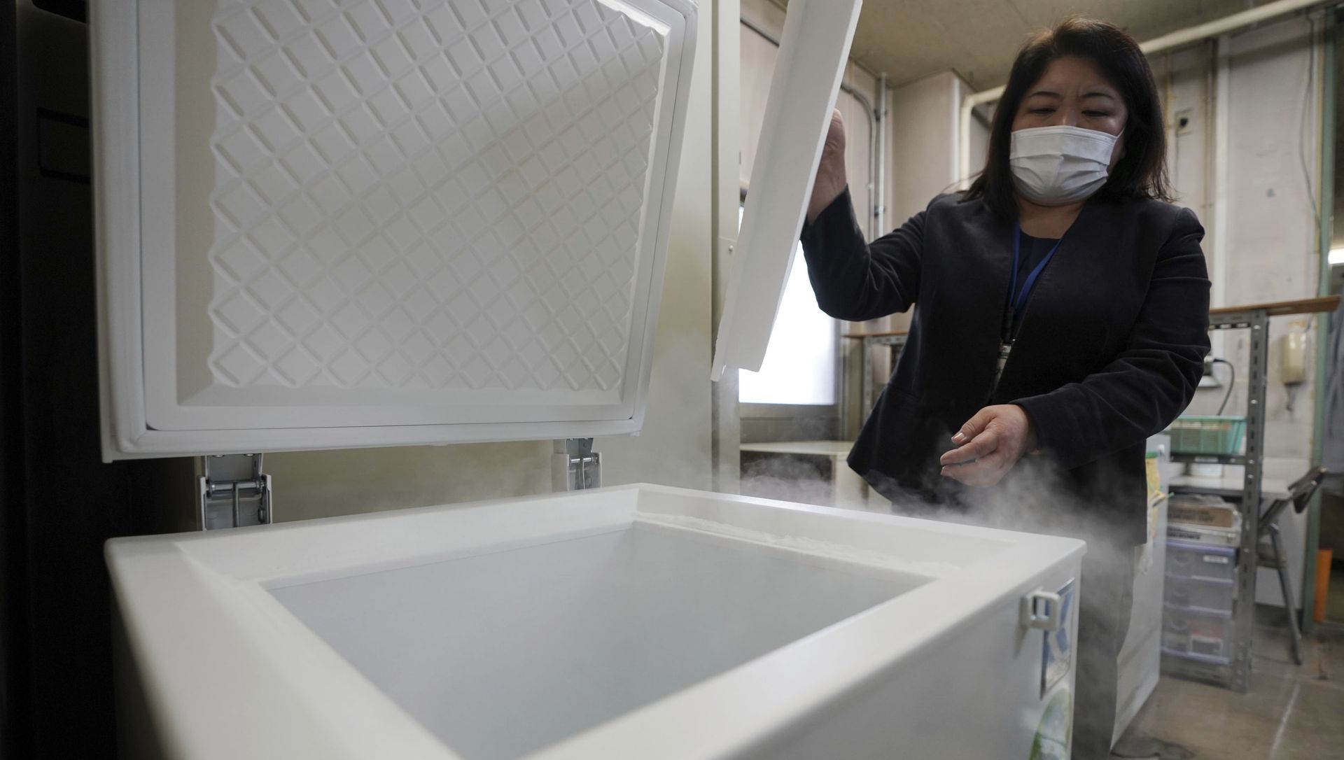 A local health staff shows a special freezer for COVID-19 vaccinations at Tokyo's Sumida ward office Friday, Jan. 22, 2021. Japan is accelerating preparations for COVID-19 vaccinations in hopes of starting them in late February, but uncertainty is growing as the country faces vaccine-shy public, slow approval process and bureaucratic roadblocks, casting a doubt if Tokyo Olympic this summer is possible. A local health staff shows a special freezer for COVID-19 vaccinations at Tokyo's Sumida ward office Friday, Jan. 22, 2021. Japan is accelerating preparations for COVID-19 vaccinations in hopes of starting them in late February, but uncertainty is growing as the country faces vaccine-shy public, slow approval process and bureaucratic roadblocks, casting a doubt if Tokyo Olympic this summer is possible. - Sputnik International, 1920, 14.03.2021