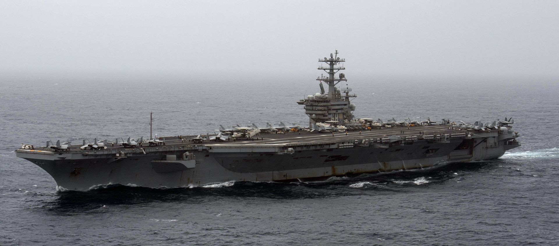 In this Sept. 7, 2020, file photo released by the U.S. Navy, the aircraft carrier USS Nimitz transits the Arabian Sea. In this Sept. 7, 2020, file photo released by the U.S. Navy, the aircraft carrier USS Nimitz transits the Arabian Sea. - Sputnik International, 1920, 17.02.2021