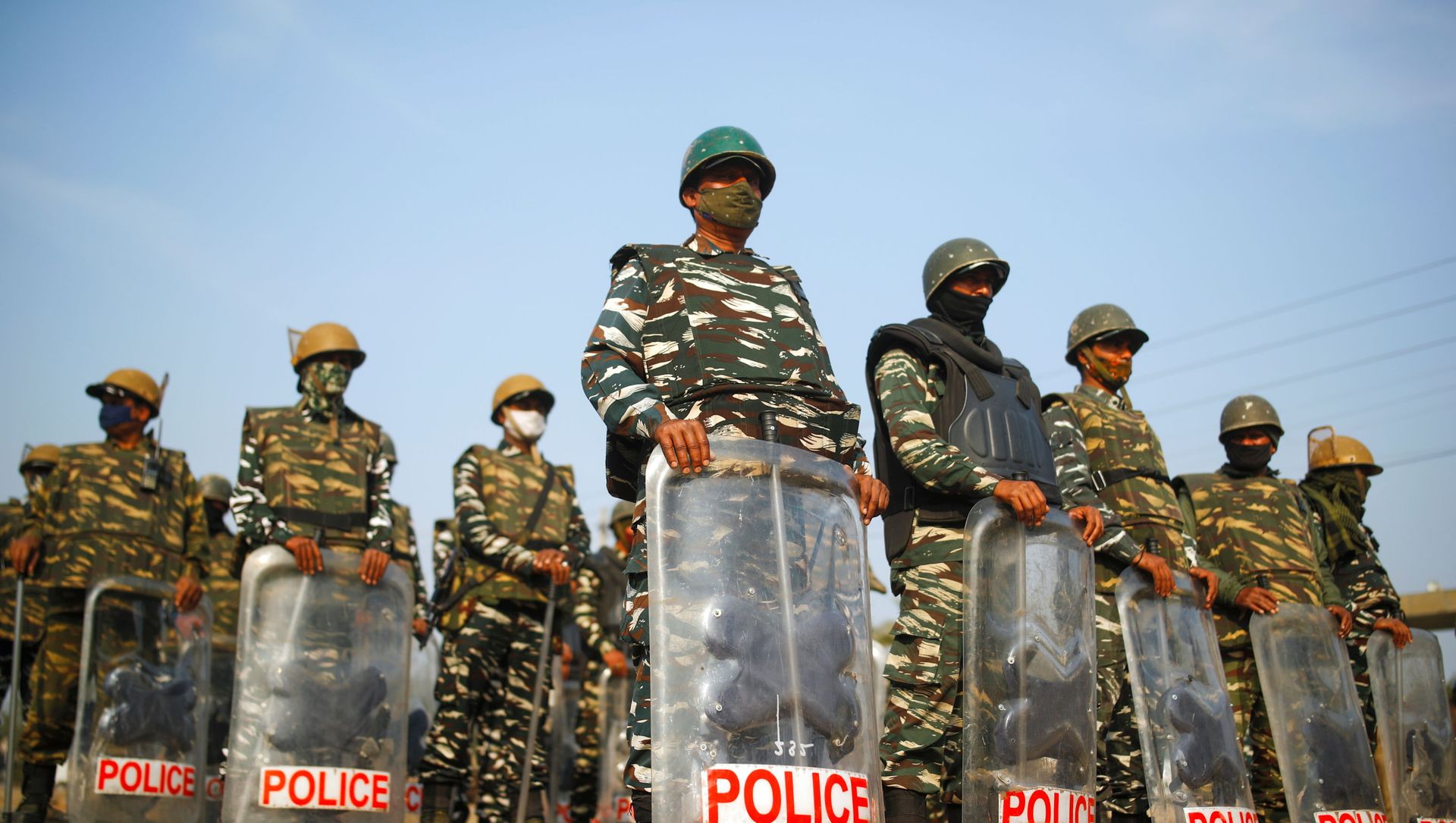 Police officers in riot gear stand guard at the site of a protest against the farm laws at Singhu border in New Delhi Police officers in riot gear stand guard at the site of a protest against the farm laws at Singhu border in New Delhi - Sputnik International, 1920, 03.02.2021