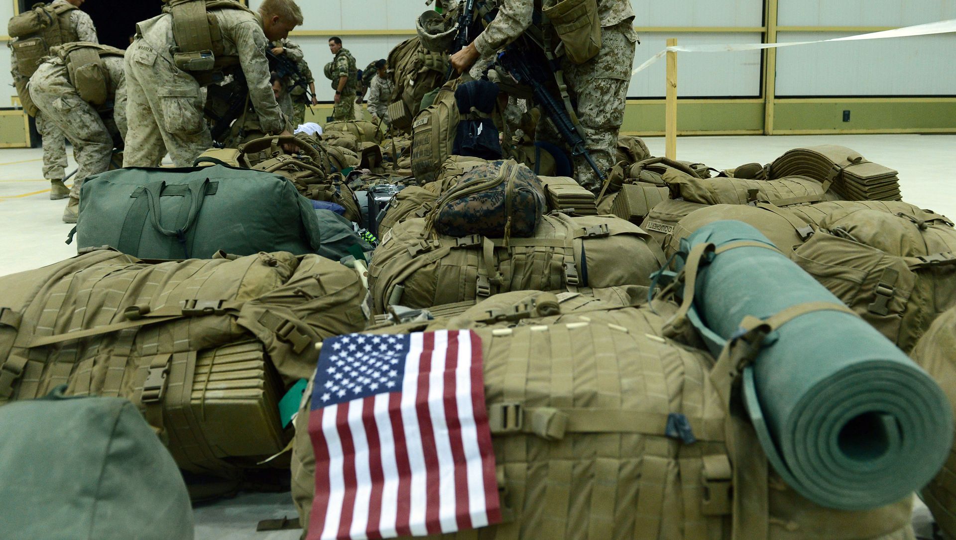 In this file photo US Marines arrange their equipment as US troops arrive in Kandahar after their withdrawl from the Camp Bastion-Leatherneck complex in Helmand province on October 26, 2014. In this file photo US Marines arrange their equipment as US troops arrive in Kandahar after their withdrawl from the Camp Bastion-Leatherneck complex in Helmand province on October 26, 2014. - Sputnik International, 1920, 03.02.2021