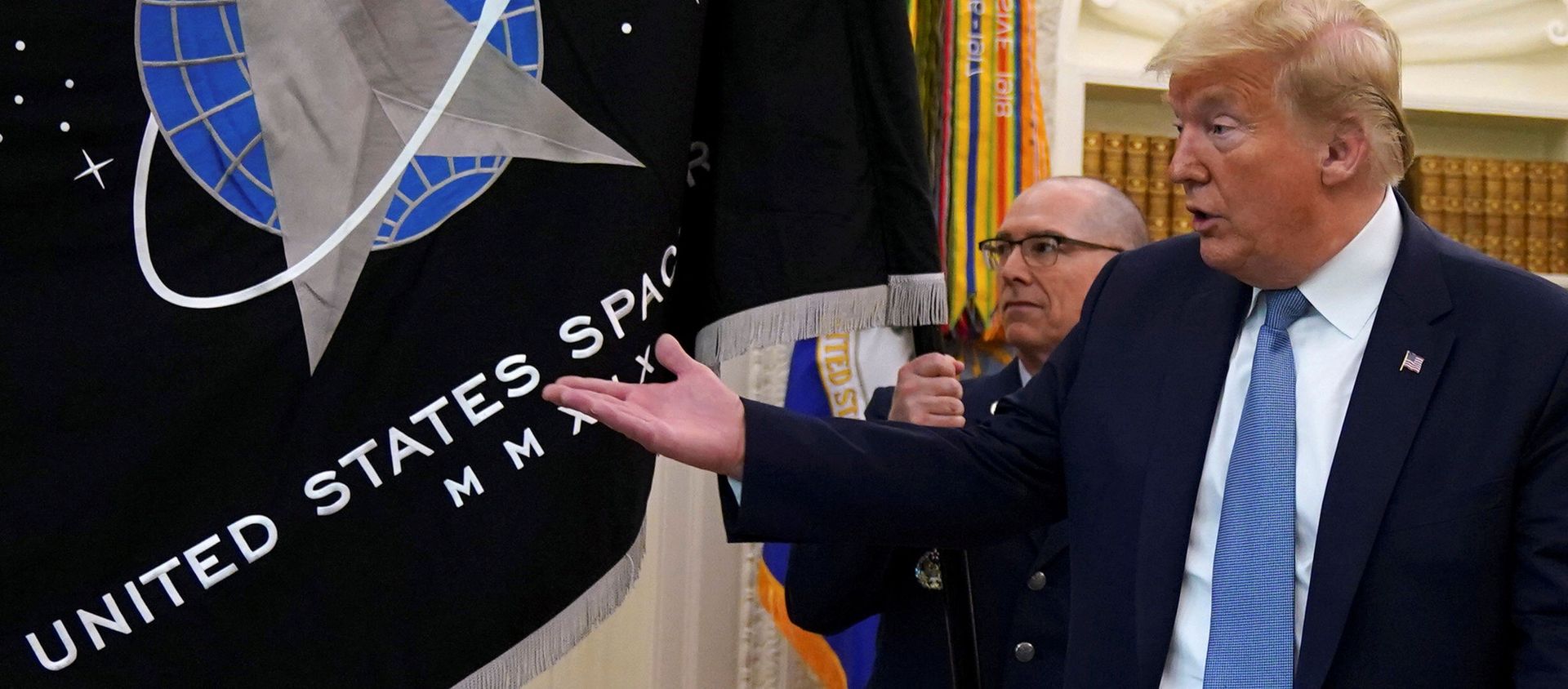 FILE PHOTO: Trump gestures towards the U.S. Space Force flag during its presentation at the White House in Washington FILE PHOTO: Trump gestures towards the U.S. Space Force flag during its presentation at the White House in Washington - Sputnik International, 1920, 04.02.2021