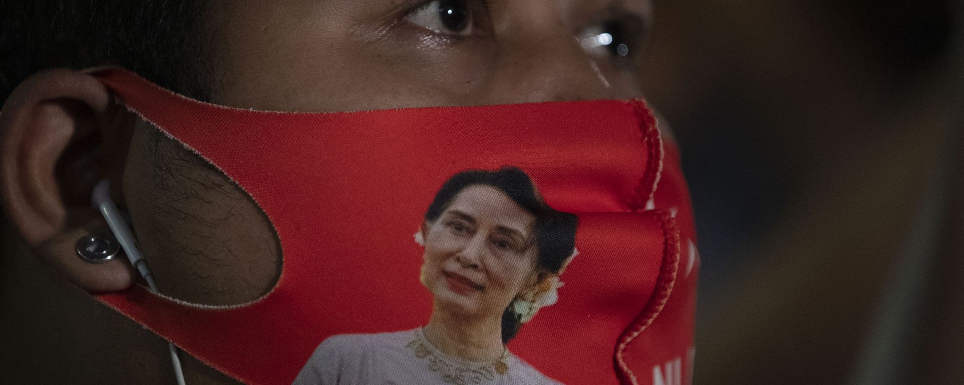 A Myanmar national living in Thailand wears a face mask with the image of Myanmar leader Aung San Suu Kyi during a protest in front of Myanmar Embassy in Bangkok, Thailand, Thursday, Feb. 4, 2021. The military announced Monday that it will take power for one year, accusing Suu Kyi's government of not investigating allegations of voter fraud in recent elections. Suu Kyi's party swept that vote and the military-backed party did poorly. The state Election Commission has refuted the allegations. A Myanmar national living in Thailand wears a face mask with the image of Myanmar leader Aung San Suu Kyi during a protest in front of Myanmar Embassy in Bangkok, Thailand, Thursday, Feb. 4, 2021. The military announced Monday that it will take power for one year, accusing Suu Kyi's government of not investigating allegations of voter fraud in recent elections. Suu Kyi's party swept that vote and the military-backed party did poorly. The state Election Commission has refuted the allegations. - Sputnik International, 1920, 16.02.2021