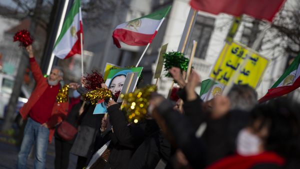 People wave flags and confetti after the trial of four persons, including an Iranian diplomate and Belgian-Iranian couple at the courthouse in Antwerp, Belgium, Thursday, Feb. 4, 2021. - Sputnik International