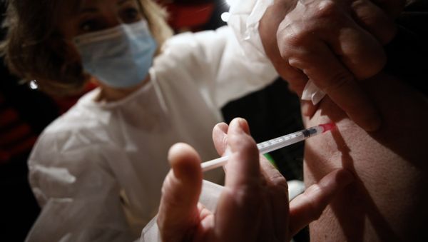 A man receives the Moderna COVID-19 vaccine at a vaccination center in Schiltigheim, eastern France, Thursday Jan. 28, 2021. - Sputnik International