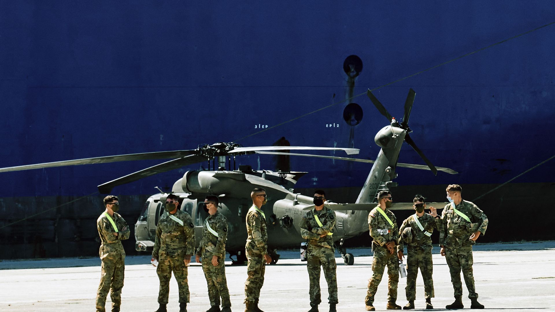 Members of U.S forces stand backdropped by a military helicopter and the U.S. troop carrier Endurance, in the northeast Greek port of Alexandroupolis, near the Turkish border, Thursday, July 23, 2020, where some 2,000 U.S. service members, dozens of helicopters and hundreds of vehicles disembarked Members of U.S forces stand backdropped by a military helicopter and the U.S. troop carrier Endurance, in the northeast Greek port of Alexandroupolis, near the Turkish border, Thursday, July 23, 2020, where some 2,000 U.S. service members, dozens of helicopters and hundreds of vehicles disembarked - Sputnik International, 1920, 05.02.2021