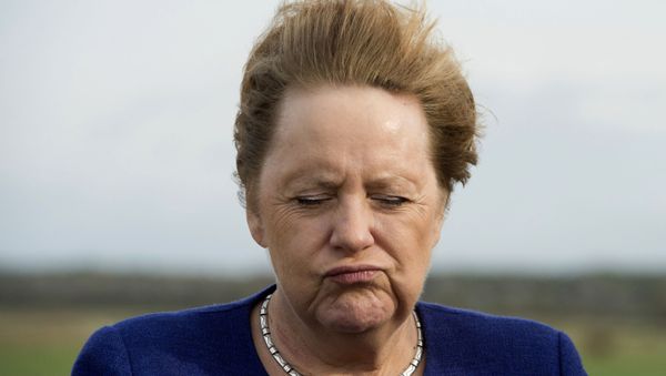 German Chancellor Angela Merkel closes her eyes as the wind blows through her hair during a visit on the small island Ummanz at the Baltic Sea, Germany, Friday, Oct. 25, 2019. (Stefan Sauer/DPA via AP) - Sputnik International