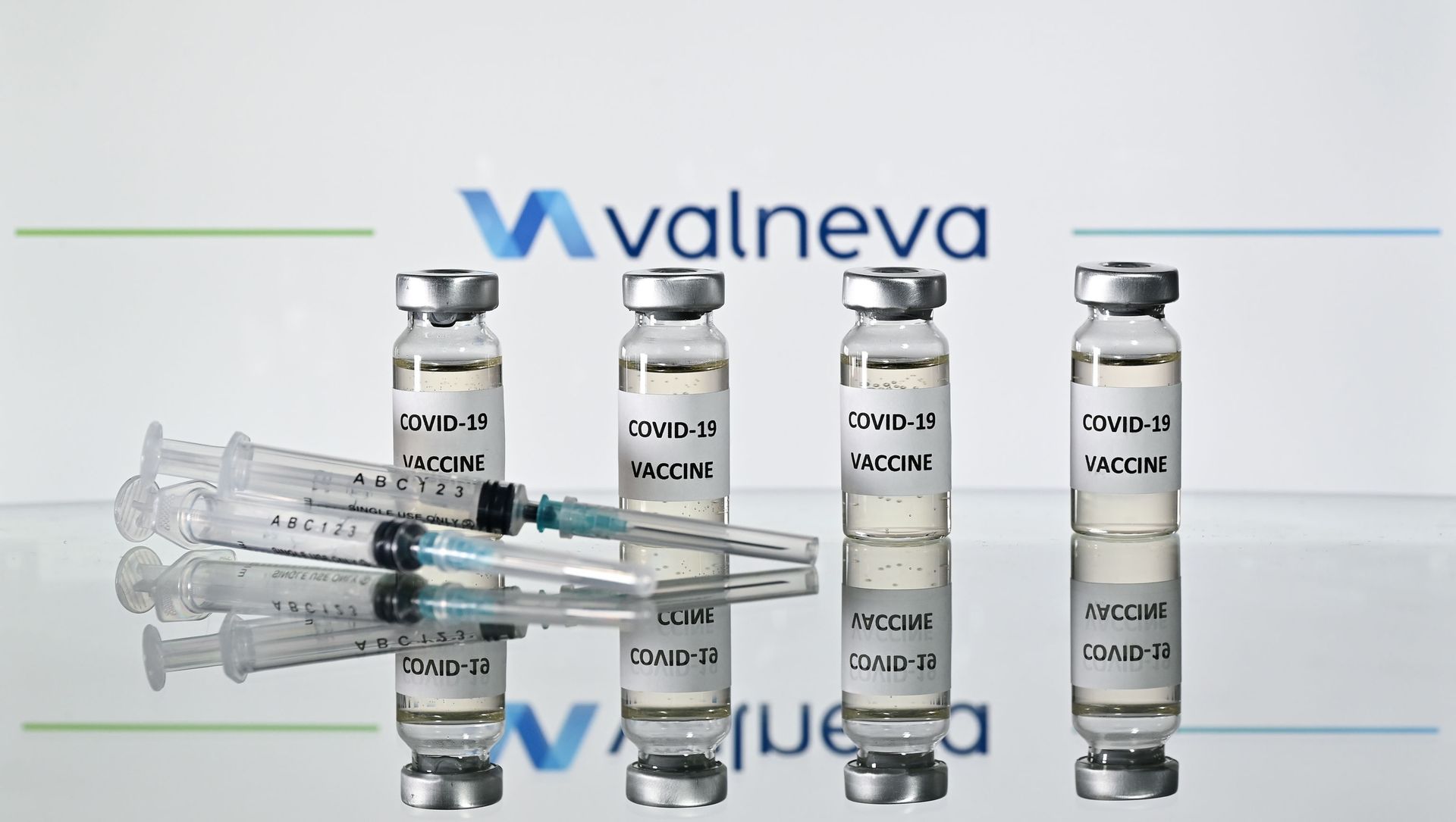 An illustration picture shows vials with Covid-19 Vaccine stickers attached and syringes with the logo of French-Austrian vaccine firm Valneva on November 17, 2020. An illustration picture shows vials with Covid-19 Vaccine stickers attached and syringes with the logo of French-Austrian vaccine firm Valneva on November 17, 2020. - Sputnik International, 1920, 05.02.2021