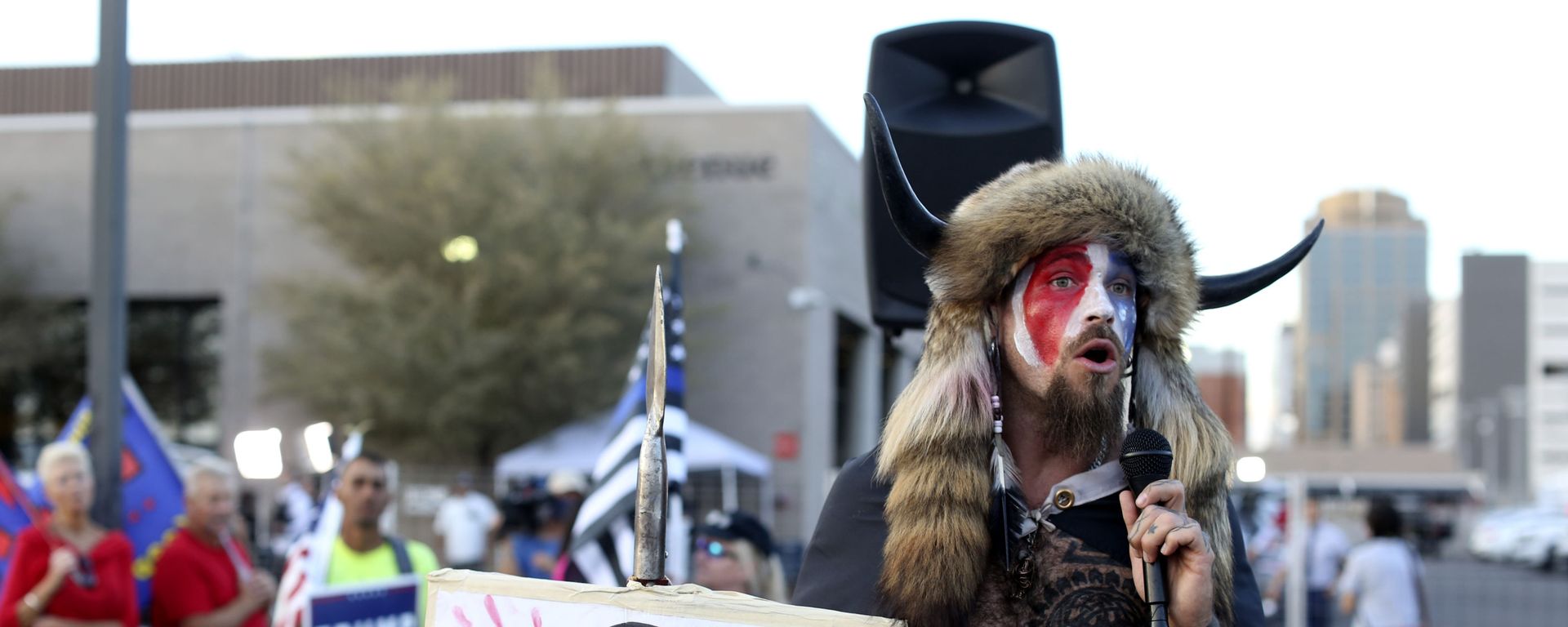 FILE - In this Nov. 5, 2020, file photo, Jacob Anthony Chansley, who also goes by the name Jake Angeli, a Qanon believer speaks to a crowd of President Donald Trump supporters outside of the Maricopa County Recorder's Office where votes in the general election are being counted, in Phoenix. In its annual report set to be released Monday, Feb. 1, 2021, the Southern Poverty Law Center said it identified 838 active hate groups operating across the U.S. in 2020. - Sputnik International, 1920, 05.02.2021