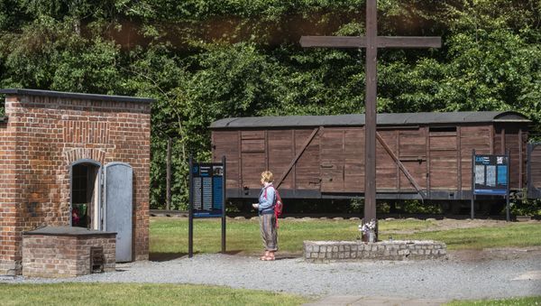 In this file photo taken on July 21, 2020 a woman is seen next to a gas chamber at the museum of the former Nazi Death Camp Stutthof, in Sztutowo, July 21, 2020. - Sputnik International