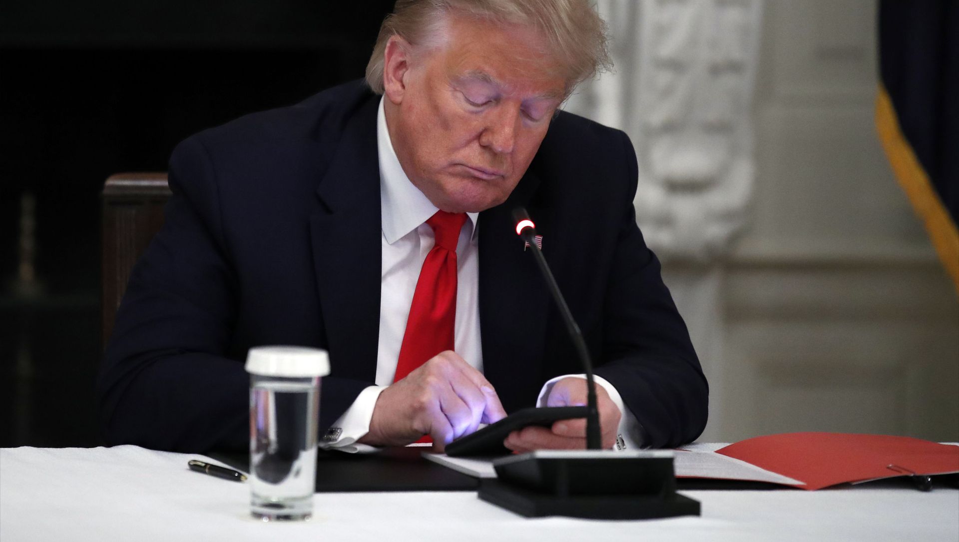 In this Thursday, June 18, 2020 file photo, President Donald Trump looks at his phone during a roundtable with governors on the reopening of America's small businesses, in the State Dining Room of the White House in Washington. In this Thursday, June 18, 2020 file photo, President Donald Trump looks at his phone during a roundtable with governors on the reopening of America's small businesses, in the State Dining Room of the White House in Washington. - Sputnik International, 1920, 06.02.2021