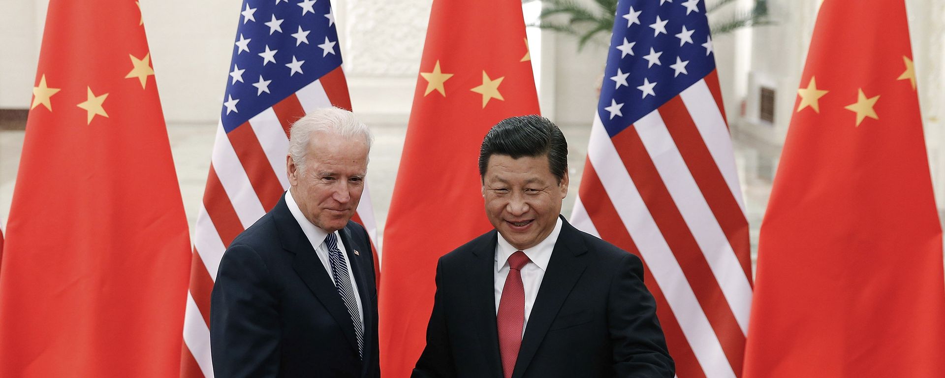 FILE - In this Dec. 4, 2013, file photo, Chinese President Xi Jinping, right, shakes hands with then U.S. Vice President Joe Biden as they pose for photos at the Great Hall of the People in Beijing. FILE - In this Dec. 4, 2013, file photo, Chinese President Xi Jinping, right, shakes hands with then U.S. Vice President Joe Biden as they pose for photos at the Great Hall of the People in Beijing. - Sputnik International, 1920, 11.11.2021