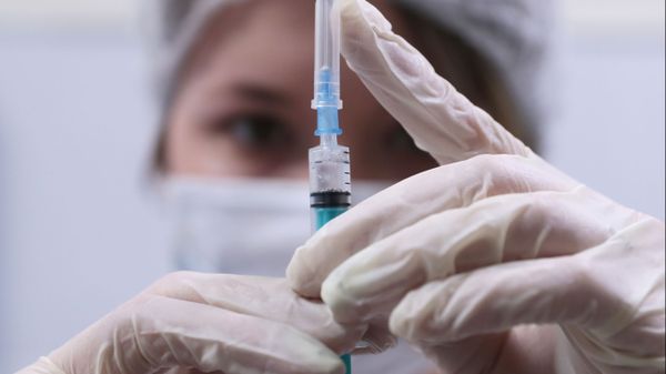 A healthcare worker prepares a dose of Russia's coronavirus vaccine Gam-COVID-Vac, trade-named Sputnik V, at a coronavirus vaccination center at a shopping mall, in Moscow, Russia. - Sputnik International