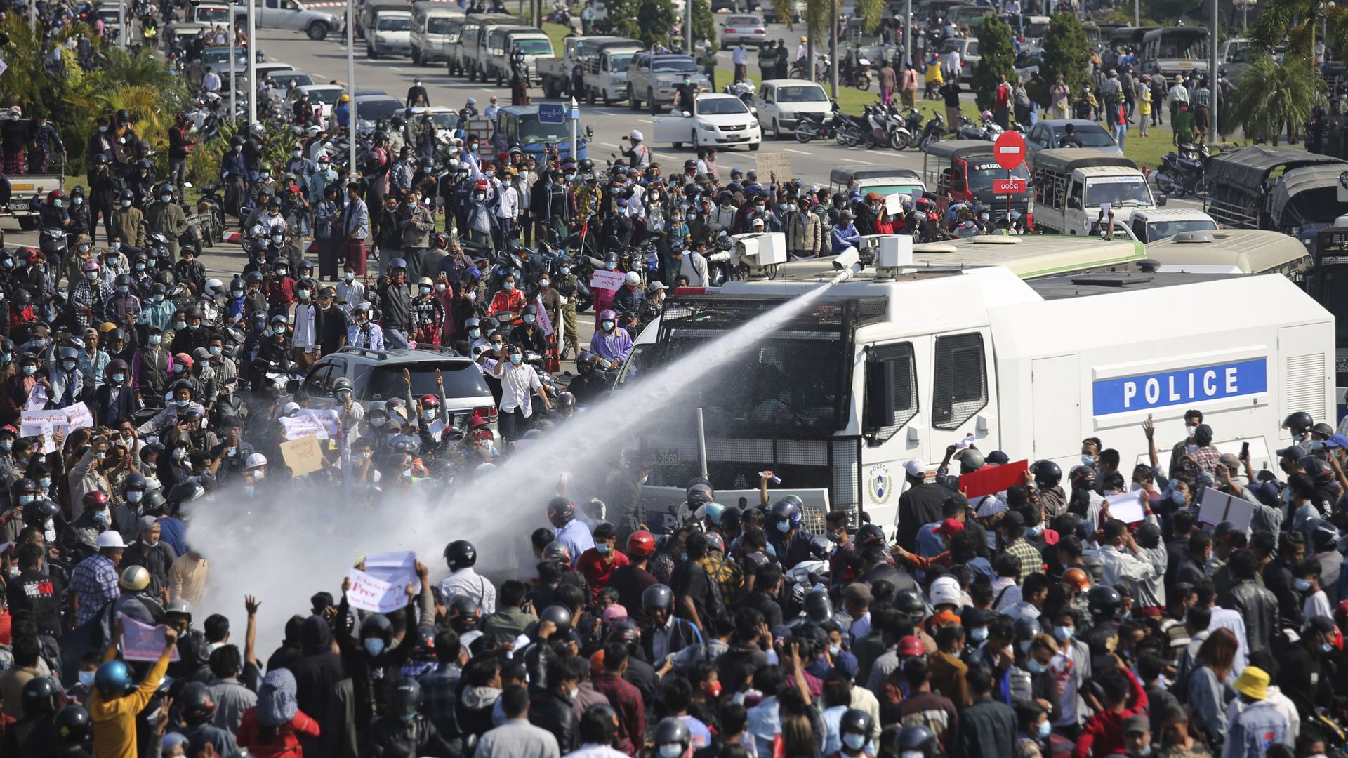 A police truck sprays water to a crowd of protesters in Naypyitaw, Myanmar on Monday, Feb. 8, 2021. A police truck sprays water to a crowd of protesters in Naypyitaw, Myanmar on Monday, Feb. 8, 2021. - Sputnik International, 1920, 22.02.2021