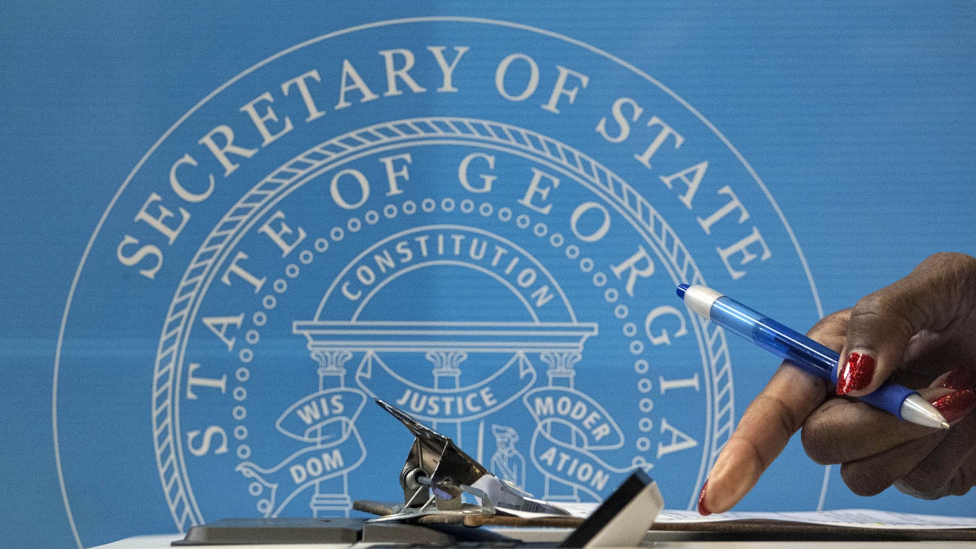 A voter fills out paperwork before casting her vote at the C.T. Martin Natatorium and Recreation Center in Atlanta on the first day of early voting for the senate runoff Monday, Dec. 14, 2020. Early in-person voting began Monday in Georgia for the state's twin U.S. Senate runoffs. The early voting period runs as late as Dec. 31 in some counties. It could determine the outcome of the races between Republican U.S. Sens. David Perdue and Kelly Loeffler and Democratic challengers Jon Ossoff and Raphael Warnock. A voter fills out paperwork before casting her vote at the C.T. Martin Natatorium and Recreation Center in Atlanta on the first day of early voting for the senate runoff Monday, Dec. 14, 2020. Early in-person voting began Monday in Georgia for the state's twin U.S. Senate runoffs. The early voting period runs as late as Dec. 31 in some counties. It could determine the outcome of the races between Republican U.S. Sens. David Perdue and Kelly Loeffler and Democratic challengers Jon Ossoff and Raphael Warnock. - Sputnik International, 1920, 13.02.2021