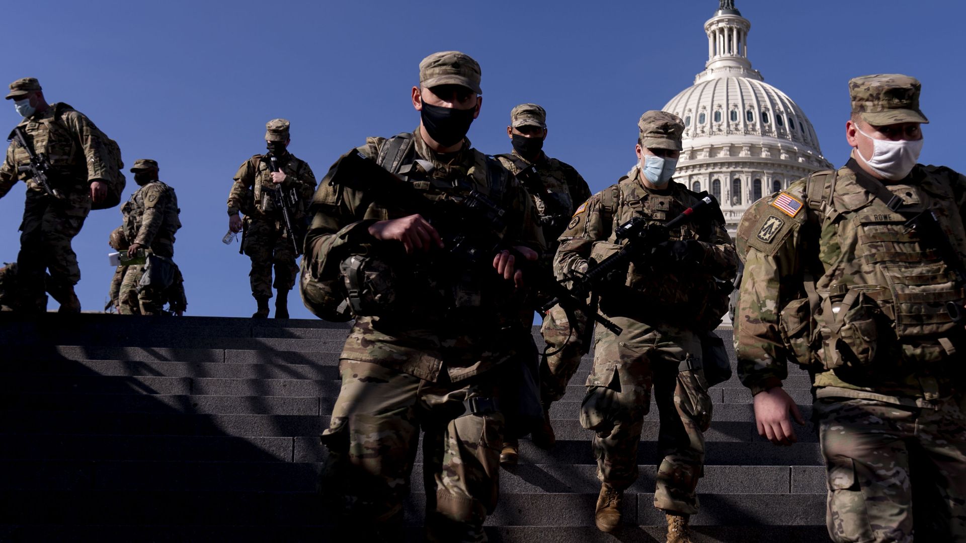 Members of the National Guard walk past the dome of the Capitol Building on Capitol Hill in Washington, Thursday, Jan. 14, 2021 Members of the National Guard walk past the dome of the Capitol Building on Capitol Hill in Washington, Thursday, Jan. 14, 2021 - Sputnik International, 1920, 18.02.2021