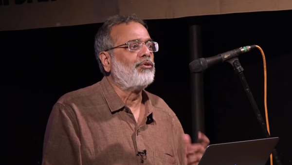 Prabir Purkayastha, editor-in-chief of NewsClick, delivers a lecture in 2018 Prabir Purkayastha, editor-in-chief of NewsClick, delivers a lecture in 2018 - Sputnik International
