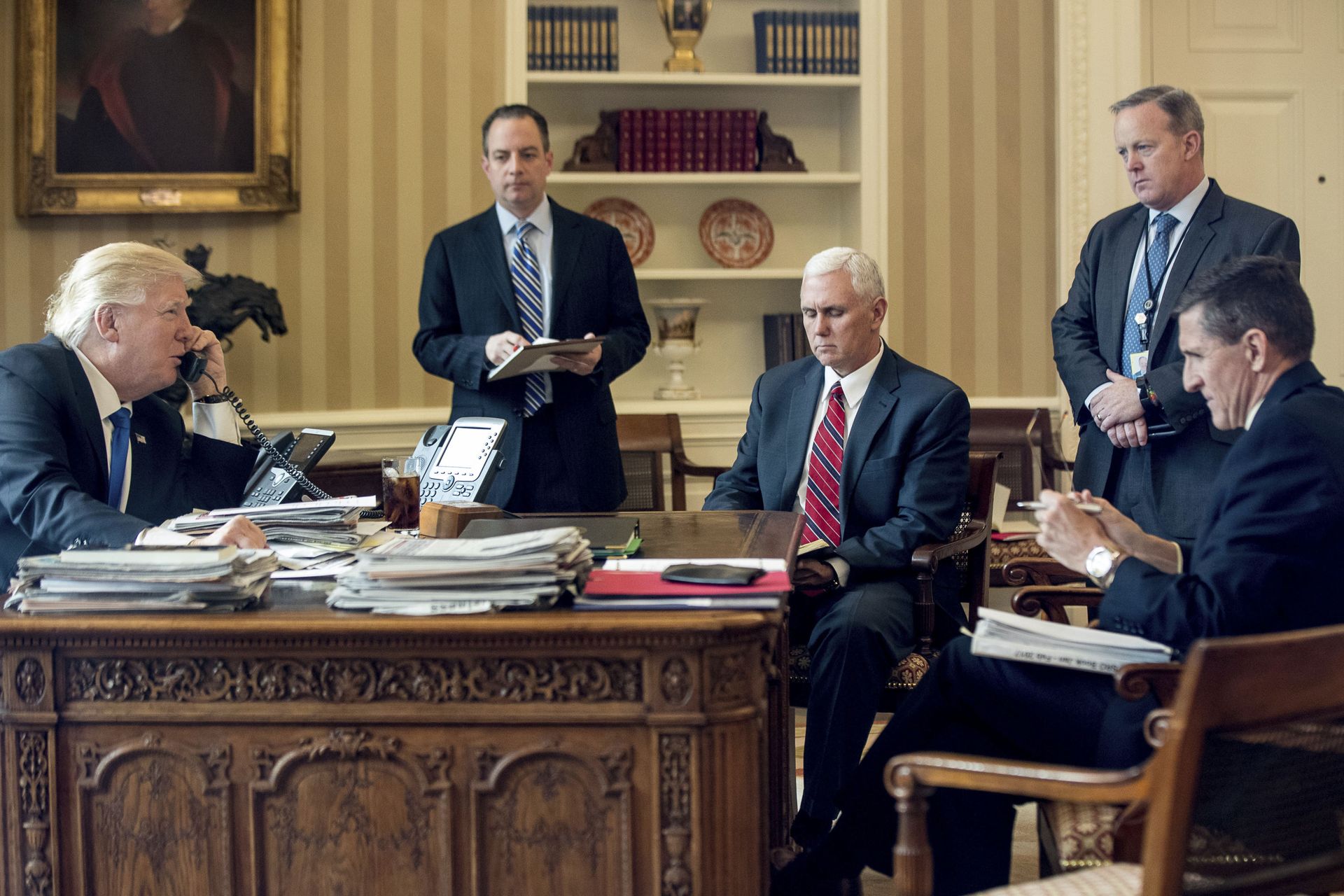 In this Jan. 28, 2017, file photo, President Donald Trump accompanied by, from second from left, Chief of Staff Reince Priebus, Vice President Mike Pence, White House press secretary Sean Spicer and National Security Adviser Michael Flynn speaks on the phone with Russian President Vladimir Putin in the Oval Office at the White House in Washington In this Jan. 28, 2017, file photo, President Donald Trump accompanied by, from second from left, Chief of Staff Reince Priebus, Vice President Mike Pence, White House press secretary Sean Spicer and National Security Adviser Michael Flynn speaks on the phone with Russian President Vladimir Putin in the Oval Office at the White House in Washington - Sputnik International, 1920, 07.09.2021