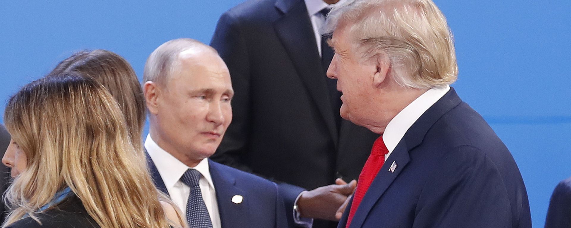 President Donald Trump, right, walk past Russia's President Vladimir Putin, left, as they gather for the group photo at the start of the G20 summit in Buenos Aires, Argentina, Friday, Nov. 30, 2018 - Sputnik International, 1920, 12.08.2025