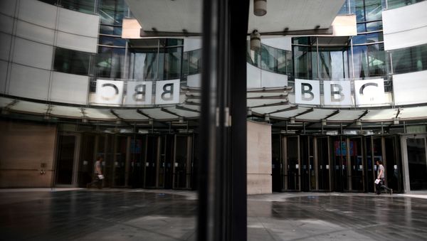 A man walks outside the BBC headquarters in Portland Place, London on July 2, 2020 - Sputnik International