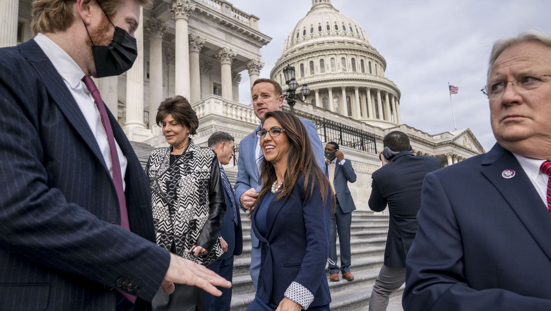 Rep. Lauren Boebert, R-Colo., centre, smiles after joining other freshman Republican House members for a group photo at the Capitol in Washington, Monday, 4 January 2021. Rep. Jerry Carl, R-Ala., is at right. Rep. Lauren Boebert, R-Colo., centre, smiles after joining other freshman Republican House members for a group photo at the Capitol in Washington, Monday, 4 January 2021. Rep. Jerry Carl, R-Ala., is at right. - Sputnik International, 1920, 29.04.2021