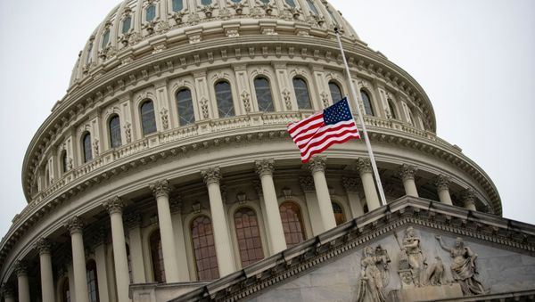 The American flag flies at half staff at the U.S. Capitol Building on the fifth day of the impeachment trial of former U.S. President Donald Trump, on charges of inciting the deadly attack on the U.S. Capitol, in Washington, U.S., February 13, 2021. - Sputnik International