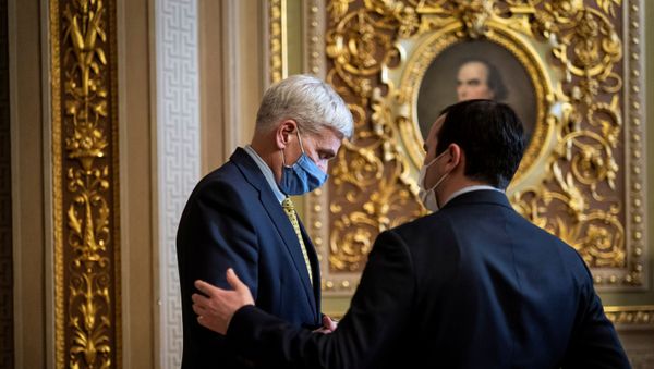 Sen. Bill Cassidy, R-La., talks with staff in the Senate Reception room on the fourth day of the Senate Impeachment trials Sen. Bill Cassidy, R-La., talks with staff in the Senate Reception room on the fourth day of the Senate Impeachment trials - Sputnik International