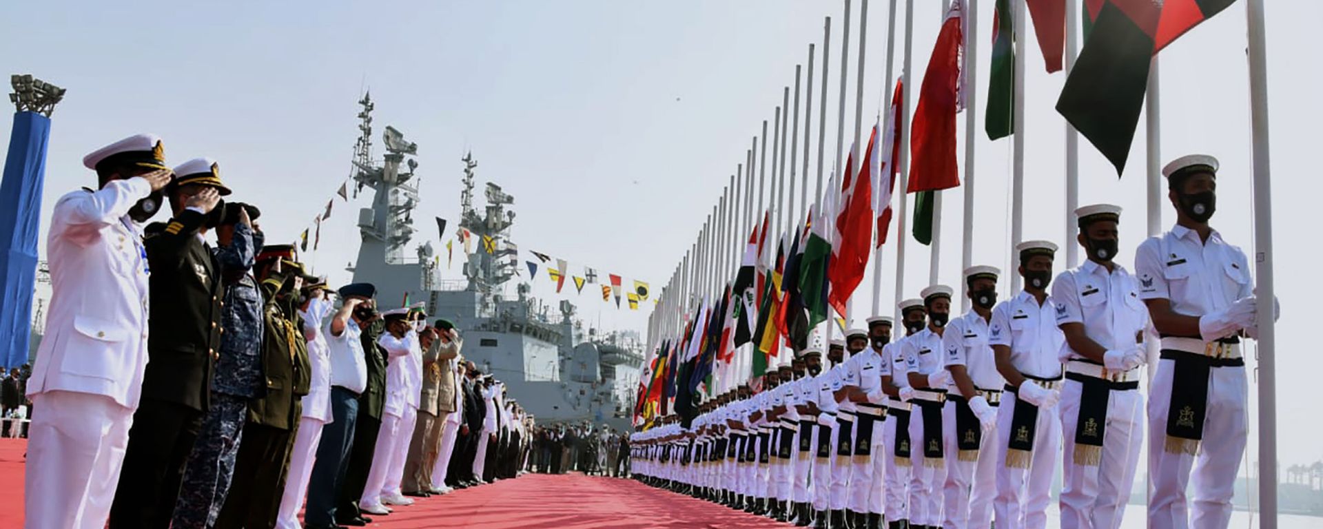 In this photo released by Pakistan Navy shows, military officials from differences countries salute during a flag hosting ceremony for multinational military exercise Aman or Peace, in Karachi, Pakistan, Friday, Feb. 12, 2021. Pakistan's Navy kicked off a five-day multinational military exercise in the Arabian Sea on Friday as part of Islamabad's years-long effort to bring security to the area, it said, although as usual regional archrival India was not invited. In this photo released by Pakistan Navy shows, military officials from differences countries salute during a flag hosting ceremony for multinational military exercise Aman or Peace, in Karachi, Pakistan, Friday, Feb. 12, 2021. Pakistan's Navy kicked off a five-day multinational military exercise in the Arabian Sea on Friday as part of Islamabad's years-long effort to bring security to the area, it said, although as usual regional archrival India was not invited. - Sputnik International, 1920, 14.02.2021