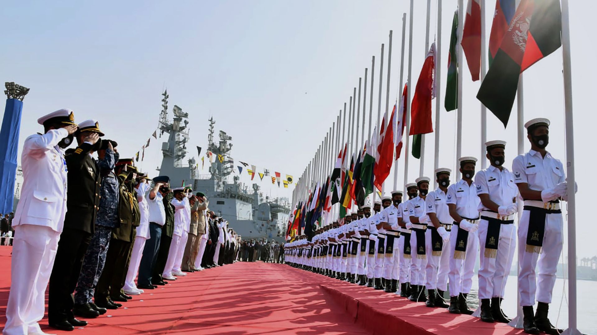 In this photo released by Pakistan Navy shows, military officials from differences countries salute during a flag hosting ceremony for multinational military exercise Aman or Peace, in Karachi, Pakistan, Friday, Feb. 12, 2021. Pakistan's Navy kicked off a five-day multinational military exercise in the Arabian Sea on Friday as part of Islamabad's years-long effort to bring security to the area, it said, although as usual regional archrival India was not invited. In this photo released by Pakistan Navy shows, military officials from differences countries salute during a flag hosting ceremony for multinational military exercise Aman or Peace, in Karachi, Pakistan, Friday, Feb. 12, 2021. Pakistan's Navy kicked off a five-day multinational military exercise in the Arabian Sea on Friday as part of Islamabad's years-long effort to bring security to the area, it said, although as usual regional archrival India was not invited. - Sputnik International, 1920, 14.02.2021