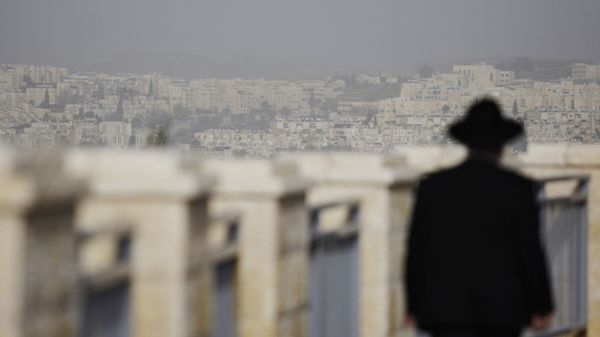 FILE -  In this Wednesday, March 10, 2010 file photo, an ultra-Orthodox Jewish man walks in the east Jerusalem neighborhood of Ramat Shlomo - Sputnik International